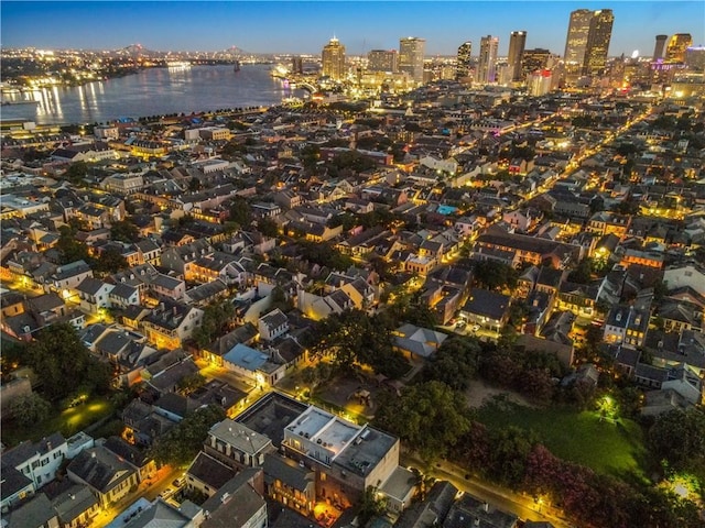 drone / aerial view featuring a view of city and a water view