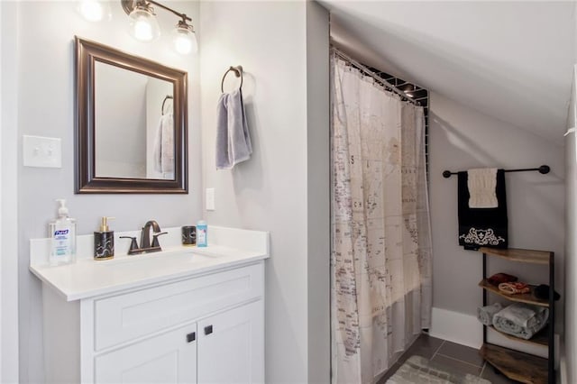 bathroom with shower / bath combination with curtain, vanity, and tile patterned flooring