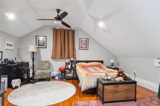 bedroom with vaulted ceiling, ceiling fan, and wood-type flooring