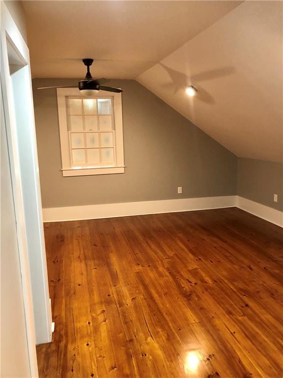 bonus room with vaulted ceiling and hardwood / wood-style flooring