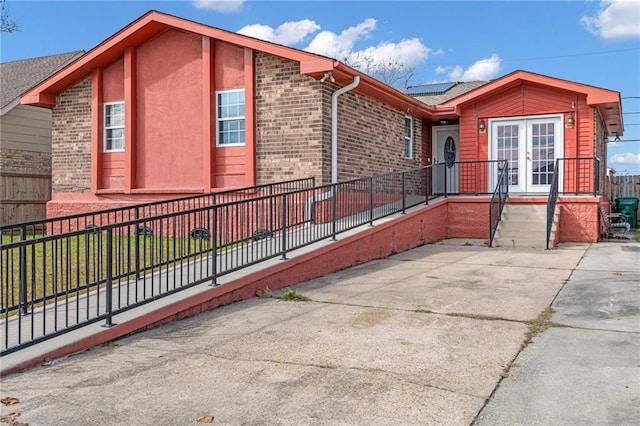 view of property exterior with french doors