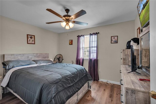 bedroom featuring ceiling fan and light hardwood / wood-style flooring