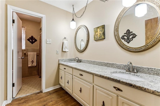 bathroom with hardwood / wood-style flooring and vanity