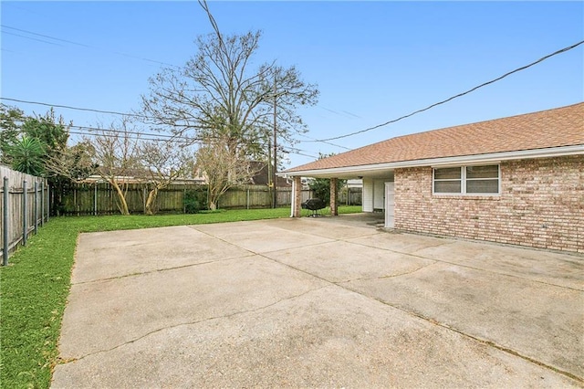 view of patio / terrace featuring a carport