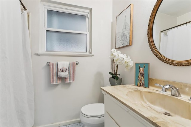 bathroom with vanity and toilet