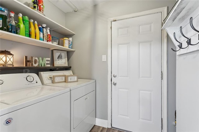 laundry room featuring hardwood / wood-style flooring and washer and dryer