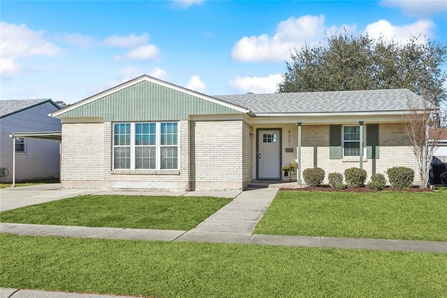 single story home with a front lawn and a carport