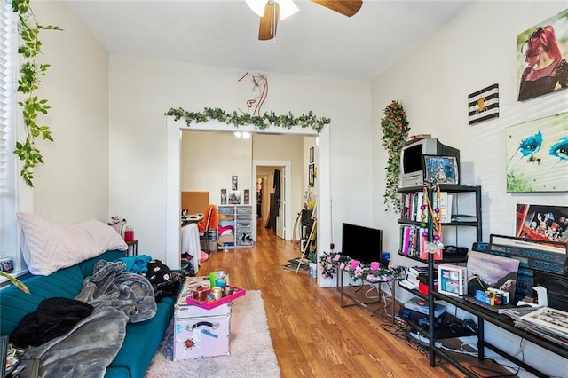 interior space with ceiling fan and wood-type flooring