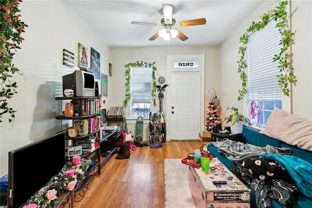 game room with ceiling fan and hardwood / wood-style flooring