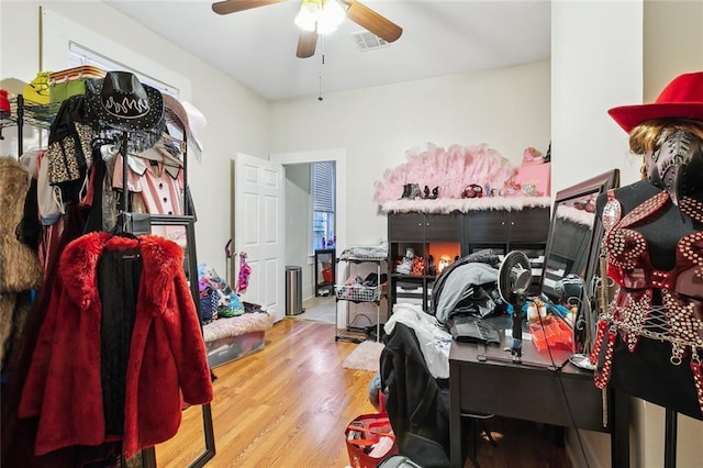 bedroom featuring ceiling fan and light hardwood / wood-style floors