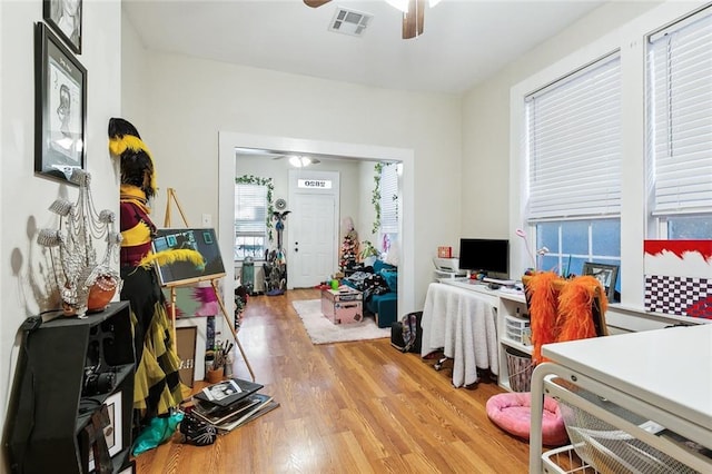 office space with ceiling fan and hardwood / wood-style flooring