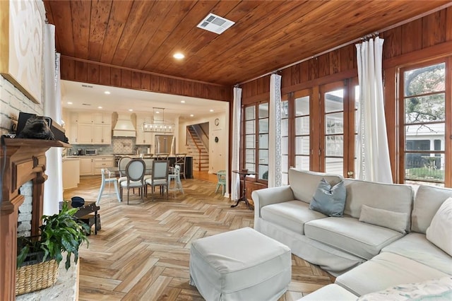 living room with light parquet floors and wood ceiling