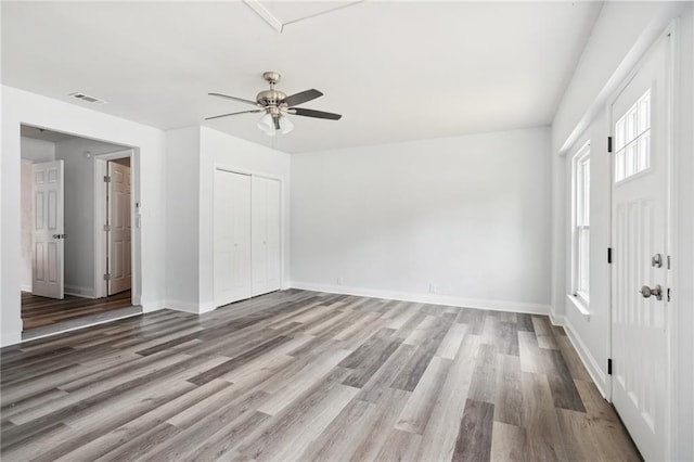 foyer with ceiling fan and hardwood / wood-style floors