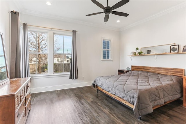 bedroom with ceiling fan, multiple windows, dark hardwood / wood-style flooring, and crown molding