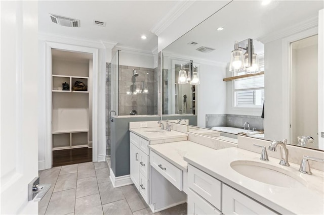 bathroom featuring ornamental molding, tile patterned floors, separate shower and tub, and vanity