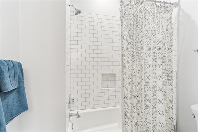 bathroom featuring toilet and shower / tub combo with curtain