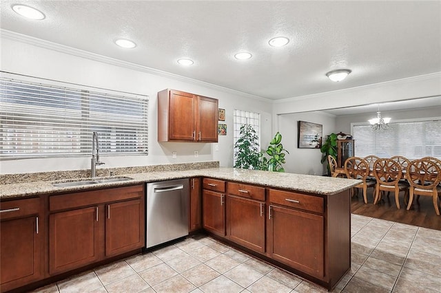 kitchen with sink, kitchen peninsula, a notable chandelier, stainless steel dishwasher, and crown molding