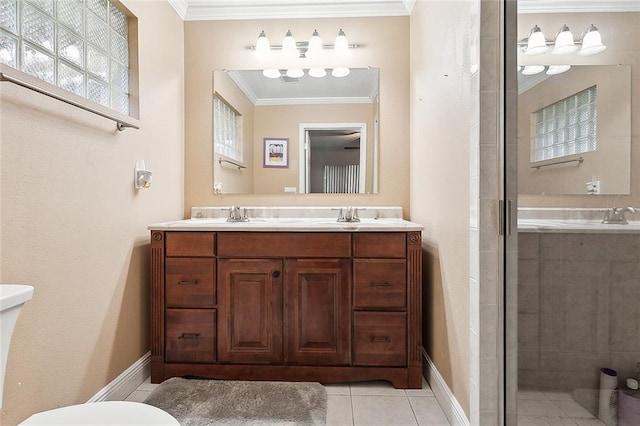 bathroom featuring toilet, vanity, tile patterned floors, a shower with shower door, and ornamental molding