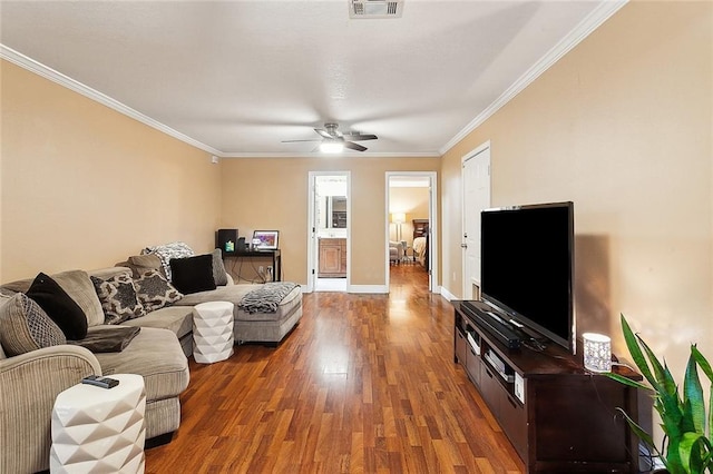 living room with ceiling fan, dark hardwood / wood-style flooring, and ornamental molding