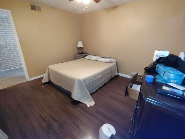 bedroom featuring ceiling fan and dark wood-type flooring