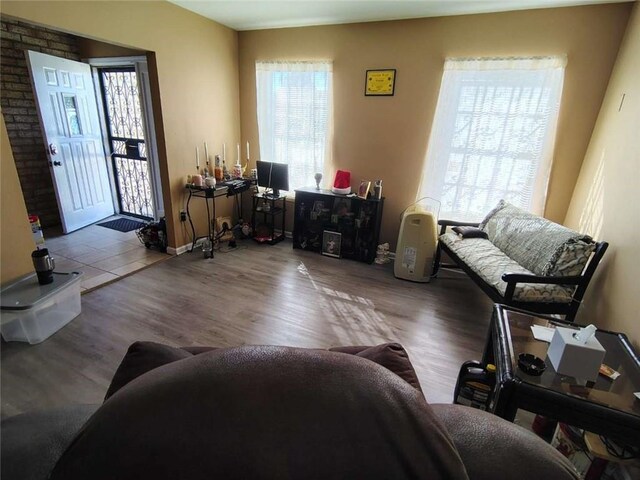 sitting room with wood-type flooring