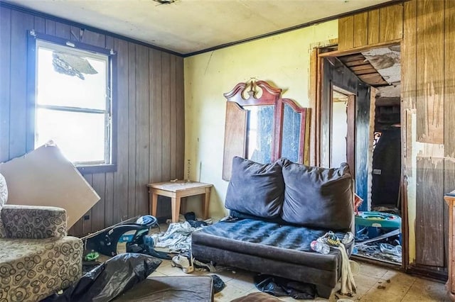 miscellaneous room with crown molding and wood walls