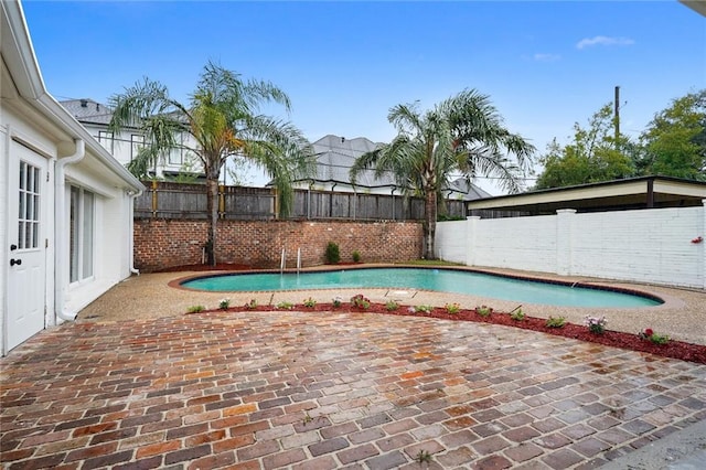 view of swimming pool featuring a patio