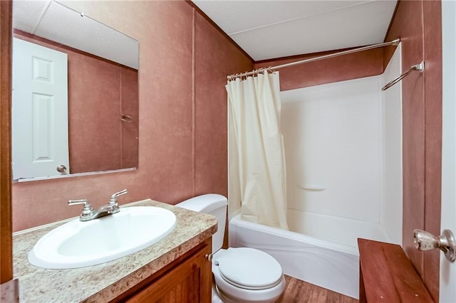bathroom featuring shower / bath combo with shower curtain, vanity, toilet, and wood finished floors