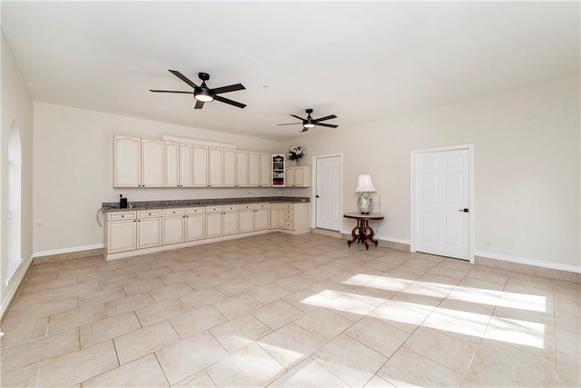 unfurnished living room with ceiling fan