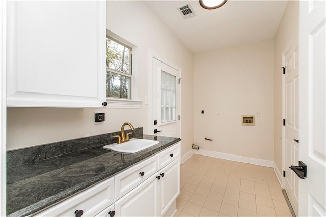 bathroom featuring vanity and tile patterned flooring