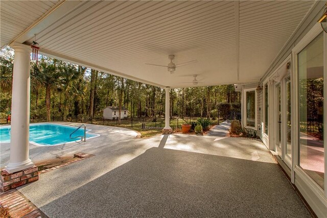 view of pool featuring ceiling fan and a patio