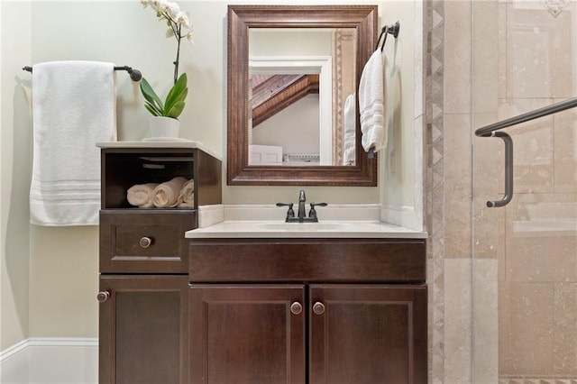 bathroom with an enclosed shower and vanity