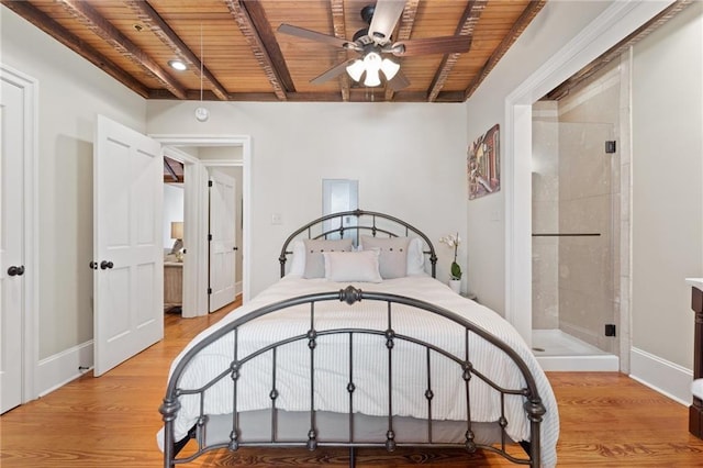 bedroom with beamed ceiling, light wood-type flooring, and wood ceiling