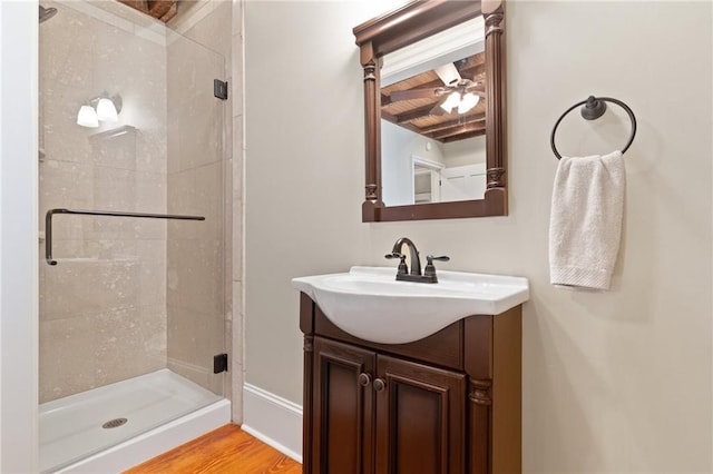 bathroom featuring wood ceiling, a shower with door, vanity, wood-type flooring, and beamed ceiling