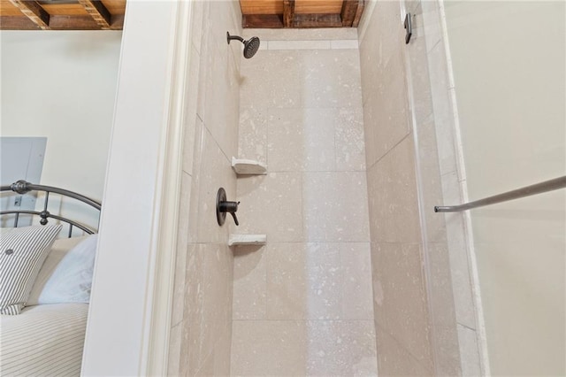 bathroom with a tile shower