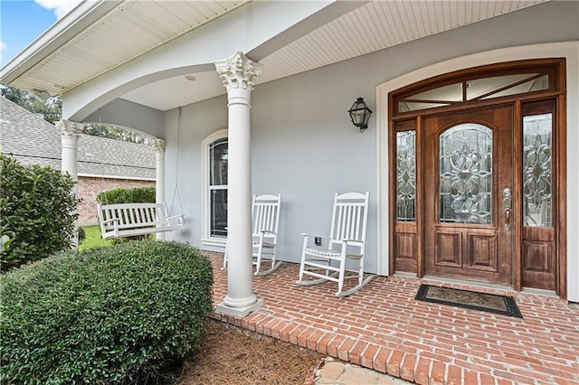 property entrance with covered porch