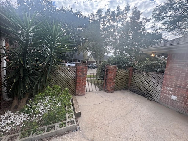 view of gate with fence