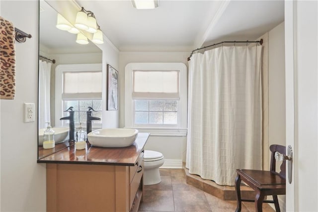 bathroom featuring toilet, a shower with shower curtain, tile patterned flooring, and vanity