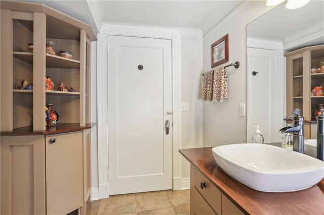 bathroom with tile patterned floors and vanity