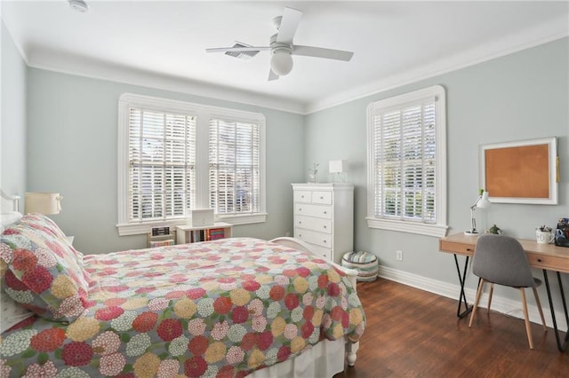 bedroom featuring ceiling fan, dark hardwood / wood-style floors, and crown molding