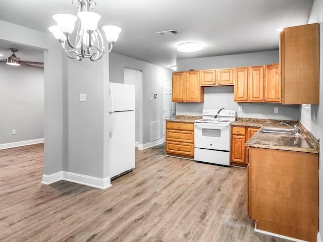 kitchen featuring decorative light fixtures, light wood-type flooring, white appliances, ceiling fan with notable chandelier, and sink