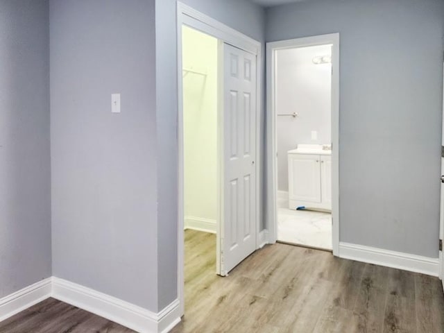 hall with light hardwood / wood-style flooring