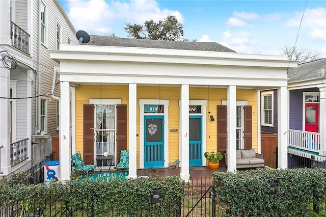 doorway to property featuring covered porch