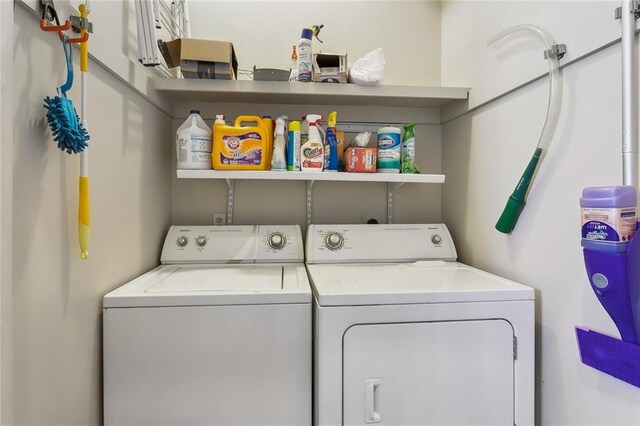 washroom featuring washer and clothes dryer