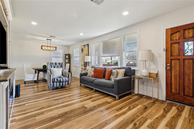 living room with light hardwood / wood-style flooring