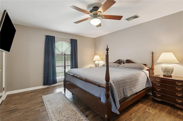 bedroom featuring ceiling fan and dark hardwood / wood-style flooring