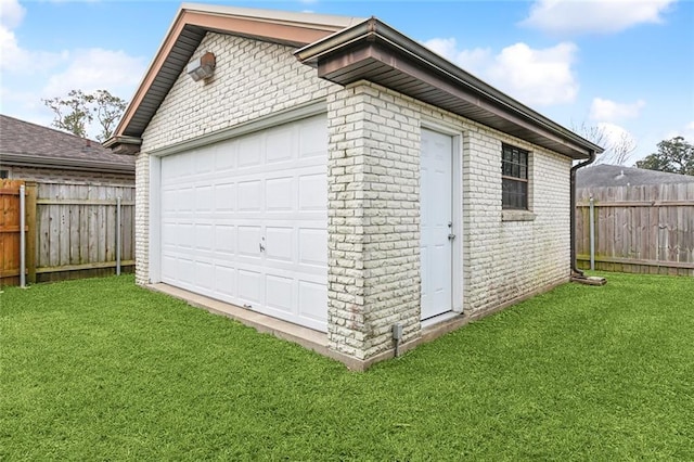 garage with a lawn