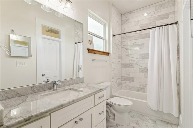 full bathroom with toilet, vanity, and shower / tub combo