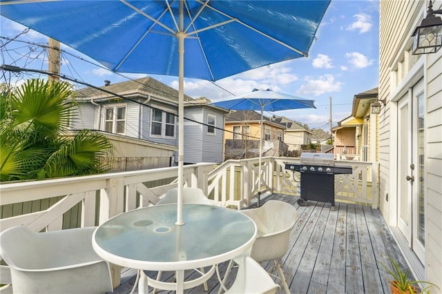 wooden deck featuring grilling area