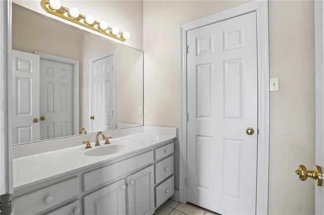 bathroom featuring tile patterned flooring and vanity